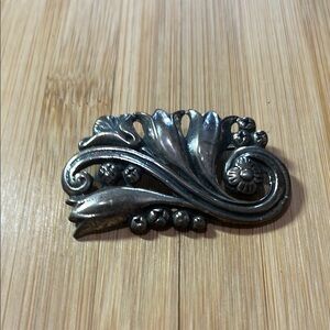 Elegant Silver Floral Brooch